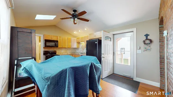 a view of a dining room with furniture window and wooden floor