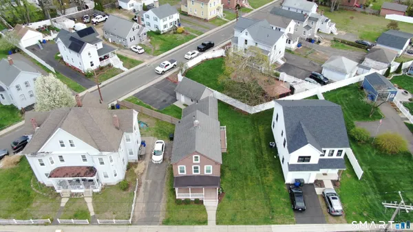 an aerial view of residential houses with outdoor space