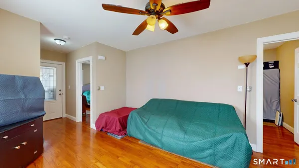 a bedroom with a bed and a chandelier