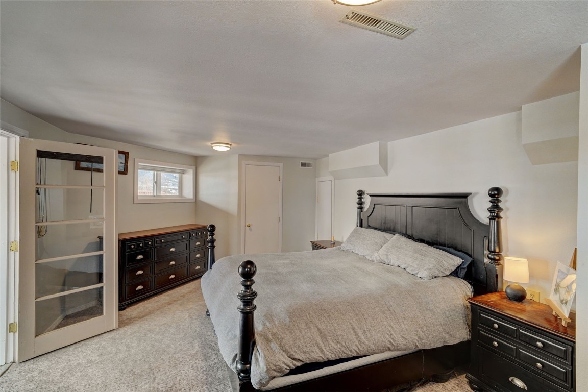 433 P Road Dillon, CO 80435 - Photo 11 of 20 a bedroom with a bed and a cabinets