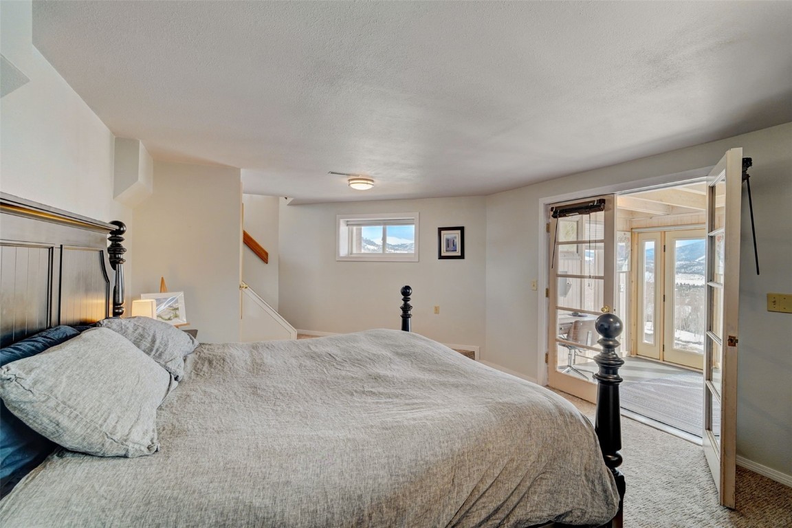 433 P Road Dillon, CO 80435 - Photo 12 of 20 a bedroom with a bed and a large window