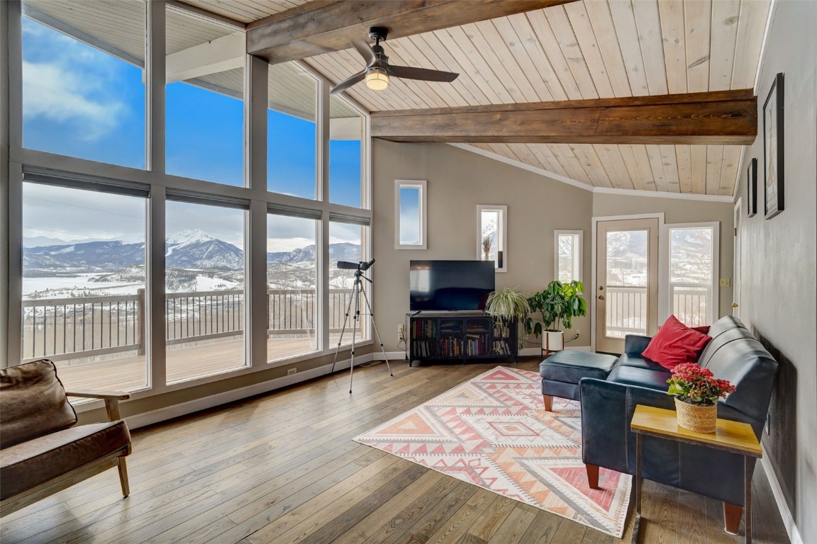 433 P Road Dillon, CO 80435 - Photo 7 of 20 a living room with furniture a flat screen tv and a floor to ceiling window