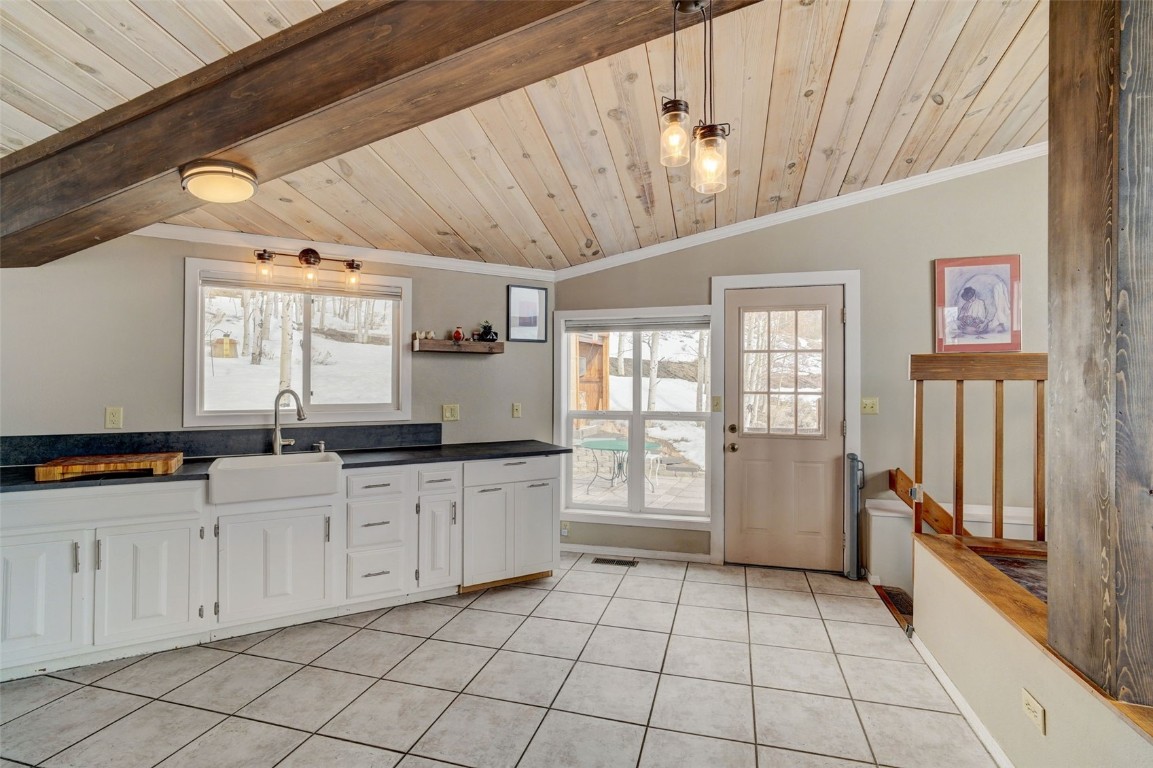 433 P Road Dillon, CO 80435 - Photo 10 of 20 a large white kitchen with a sink a refrigerator and window