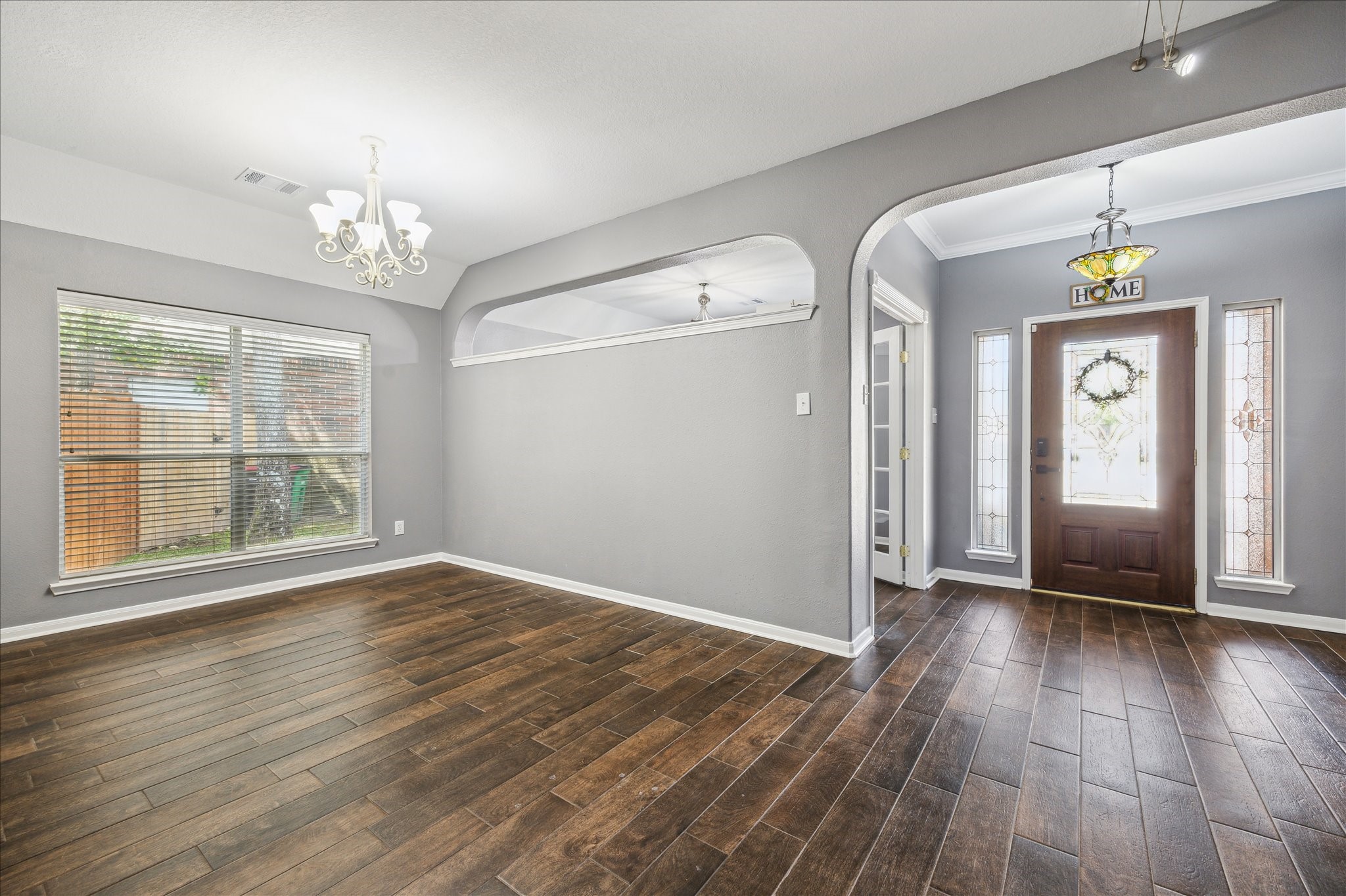 20910 Sandy Briar Court Spring, TX 77379 - Photo 6 of 28 an empty room with wooden floor and windows