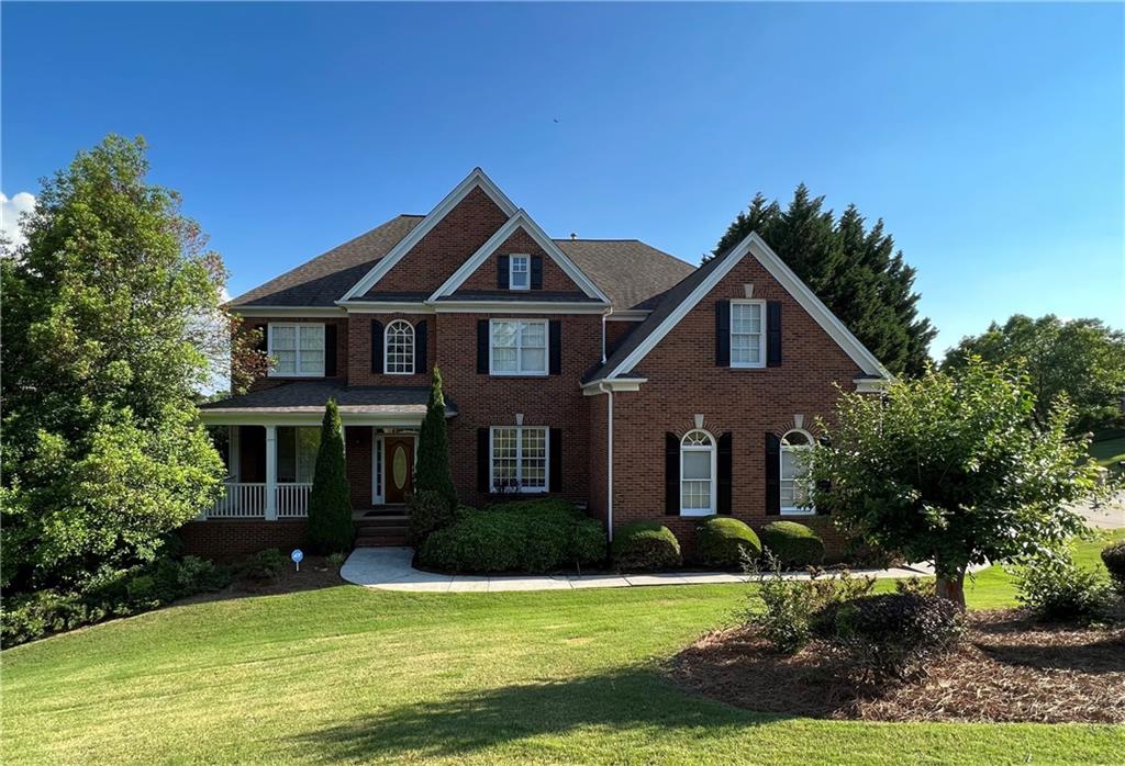 5540 Wake Forrest Run Duluth, GA 30097 - Photo 1 of 1 a front view of a house with a yard