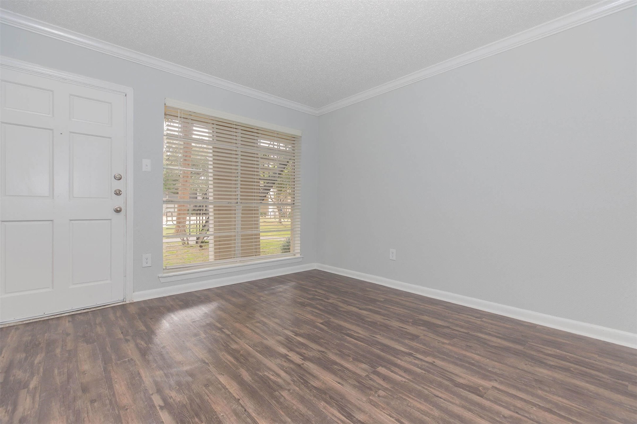 3001 Hillcroft Street, Unit G0504 Houston, TX 77057 - Photo 18 of 50 a view of an empty room with wooden floor and a window