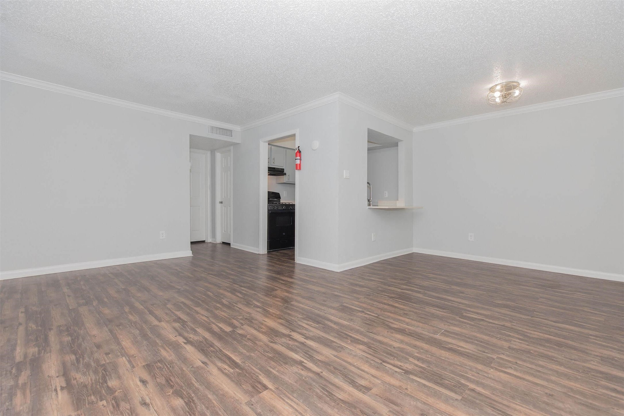 3001 Hillcroft Street, Unit G0504 Houston, TX 77057 - Photo 19 of 50 a view of empty room with wooden floor and cabinet