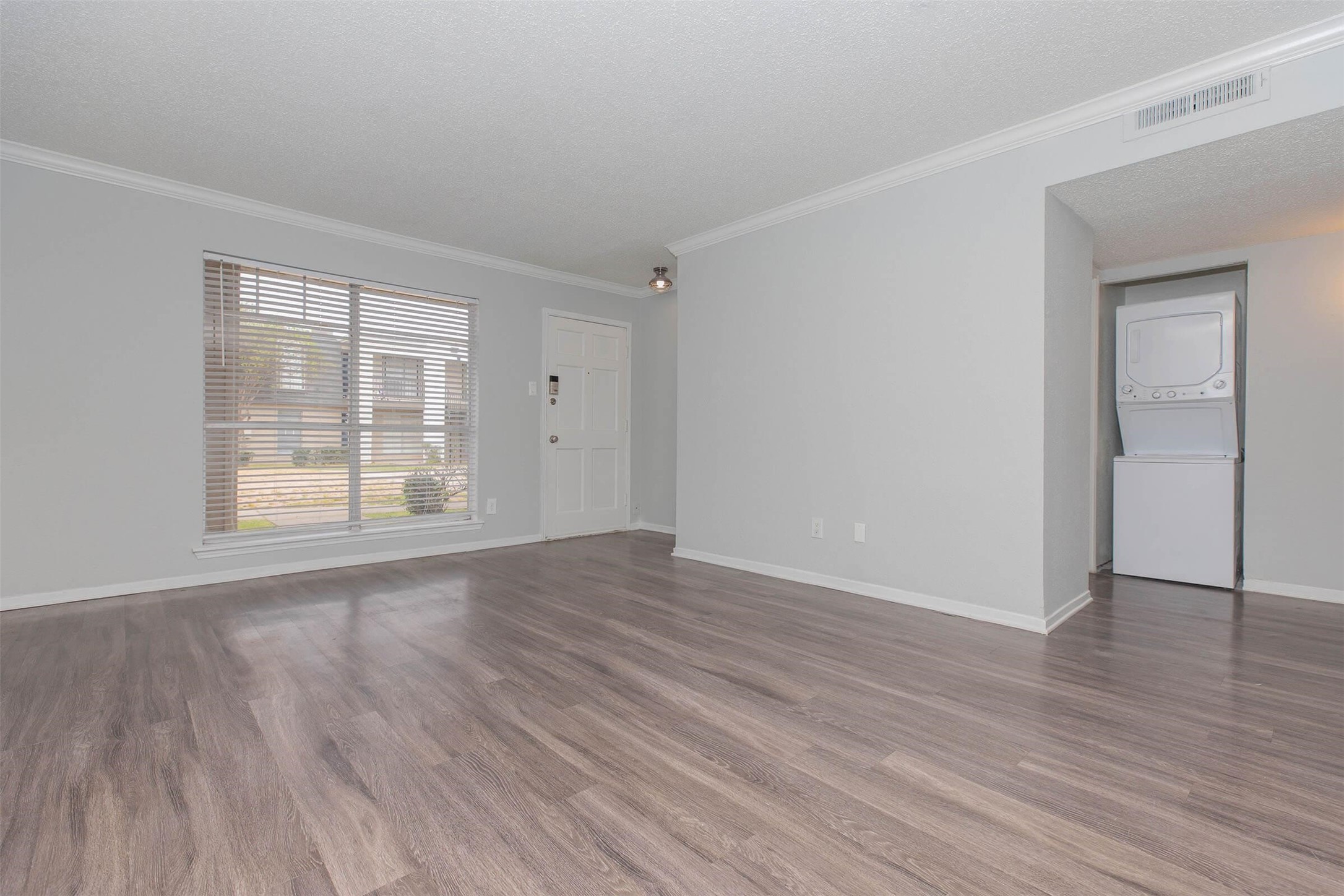 3001 Hillcroft Street, Unit G0504 Houston, TX 77057 - Photo 10 of 50 a view of an empty room with wooden floor and a window