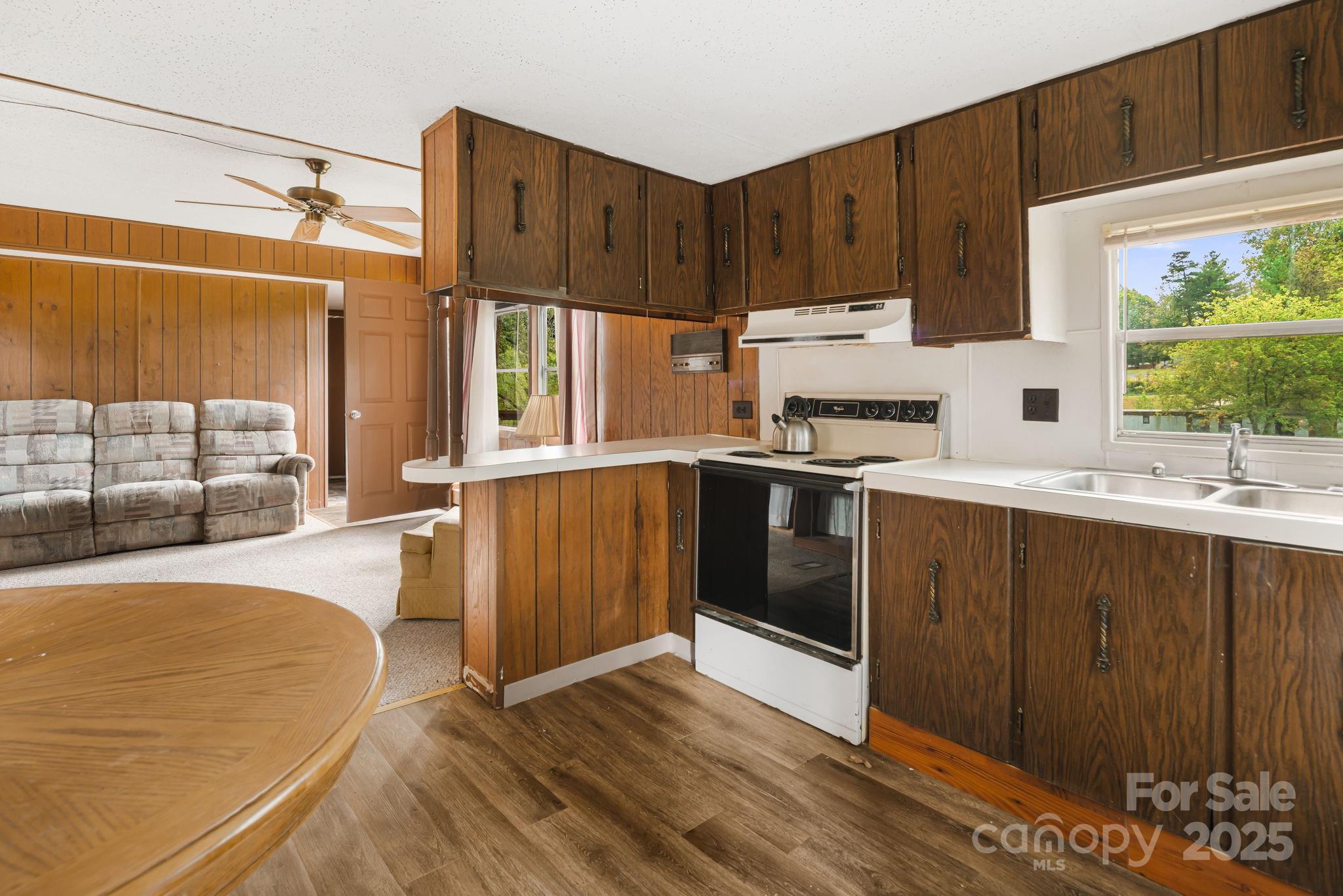 18 Bianca Way Alexander, NC 28701 - Photo 27 of 30 a kitchen with stainless steel appliances granite countertop a stove a sink dishwasher and a refrigerator