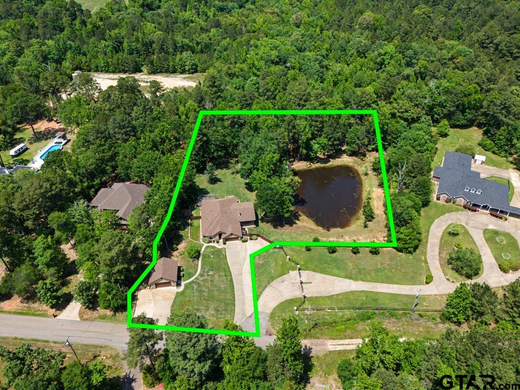 449 Greenhill Road Longview, TX 75605 - Photo 2 of 48 an aerial view of a house with a garden and a yard