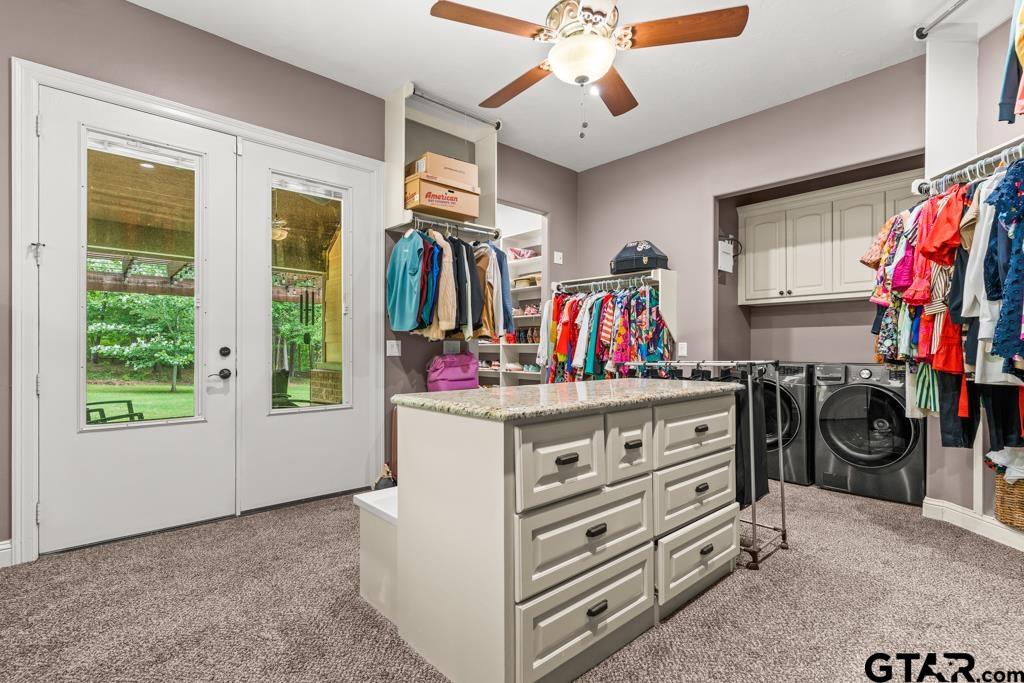 449 Greenhill Road Longview, TX 75605 - Photo 21 of 48 a view of walk in closet with clothes and shoes