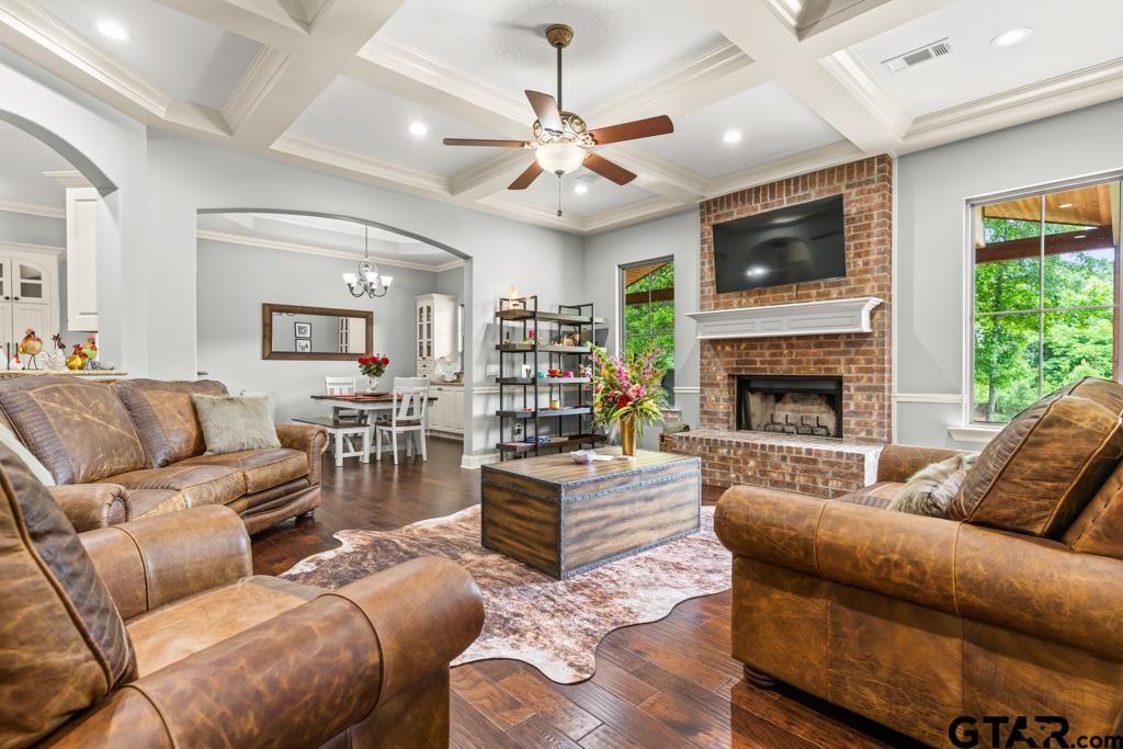 449 Greenhill Road Longview, TX 75605 - Photo 7 of 48 a living room with furniture a fireplace and a flat screen tv