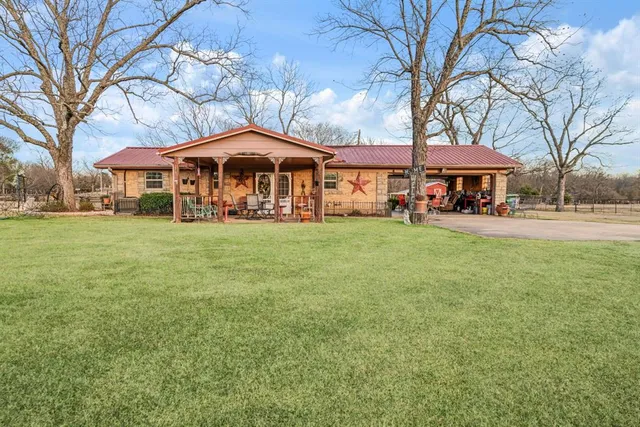 a view of a terrace with a lake and mountain view
