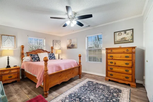 a bathroom with a granite countertop sink toilet a mirror and a shower