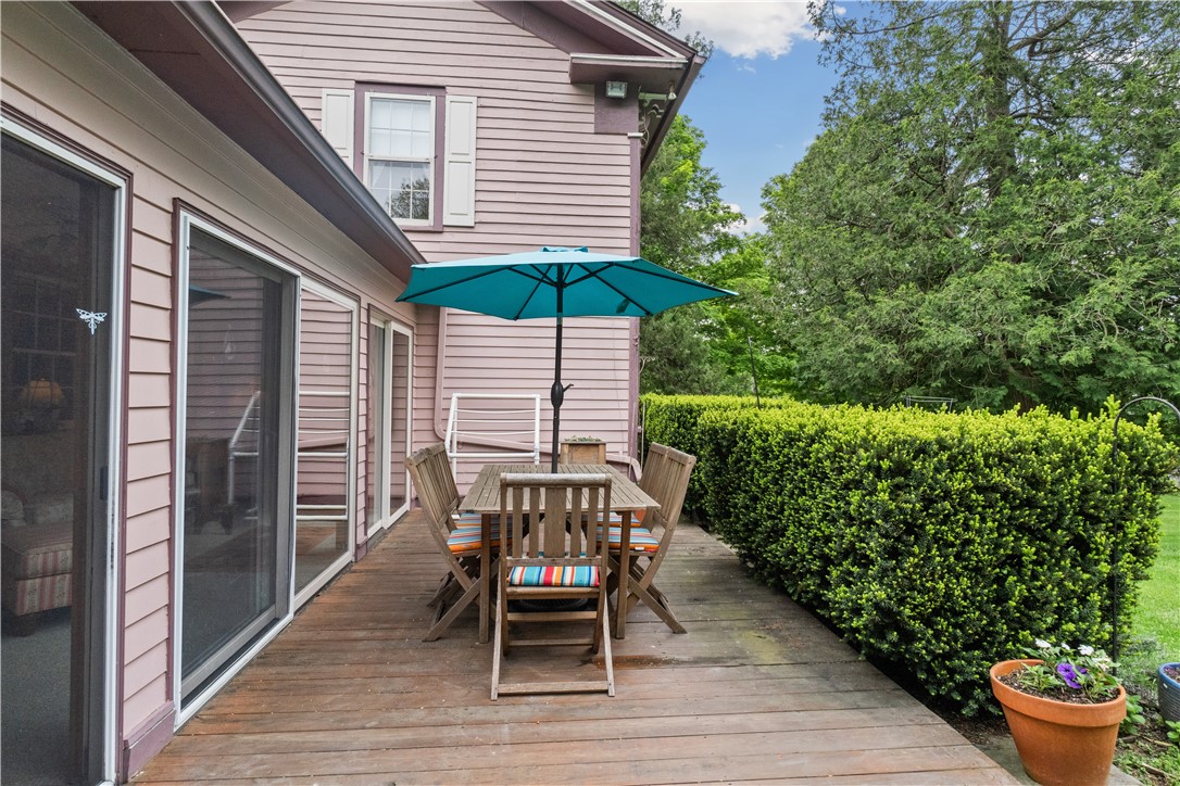 1096 West Lake Road Jerusalem, NY 14418 - Photo 23 of 49 Back patio with level access to lawn and out build