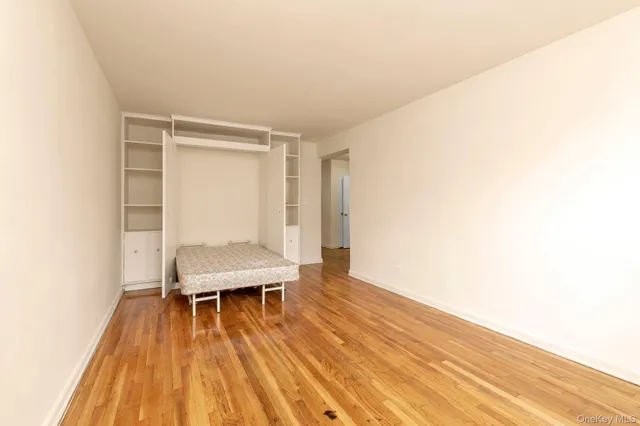 a room with a wooden floor and a table