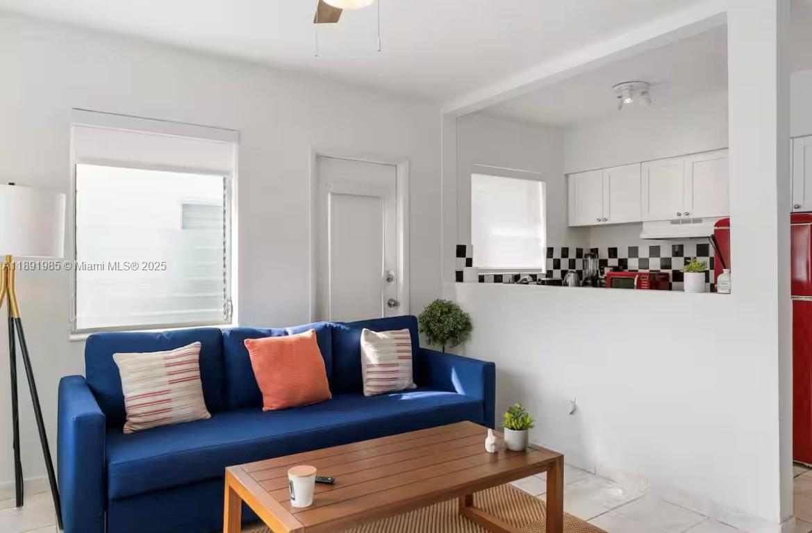 7721 Harding Avenue, Unit 8 Miami Beach, FL 33141 - Photo 2 of 14 a living room with furniture and a couch