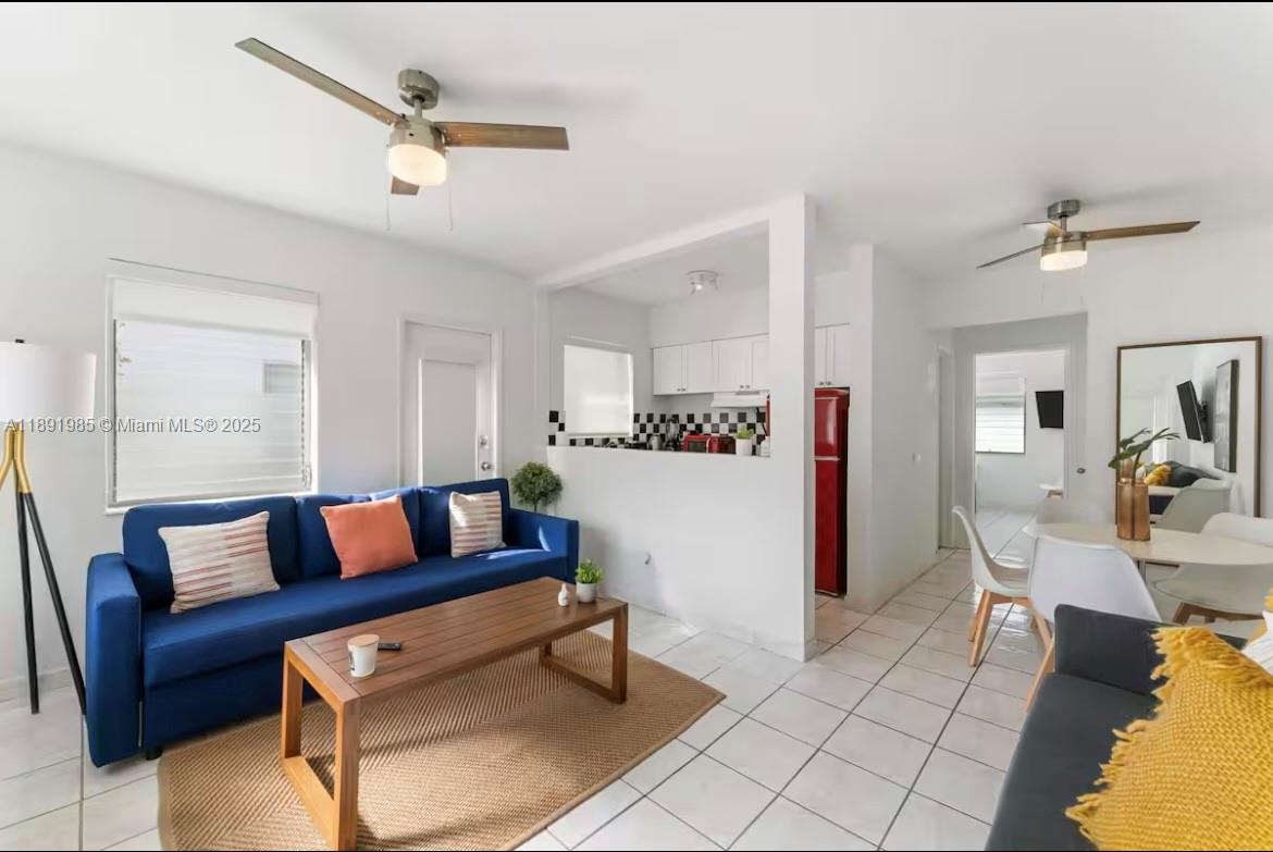 7721 Harding Avenue, Unit 8 Miami Beach, FL 33141 - Photo 3 of 14 a living room with furniture and a table