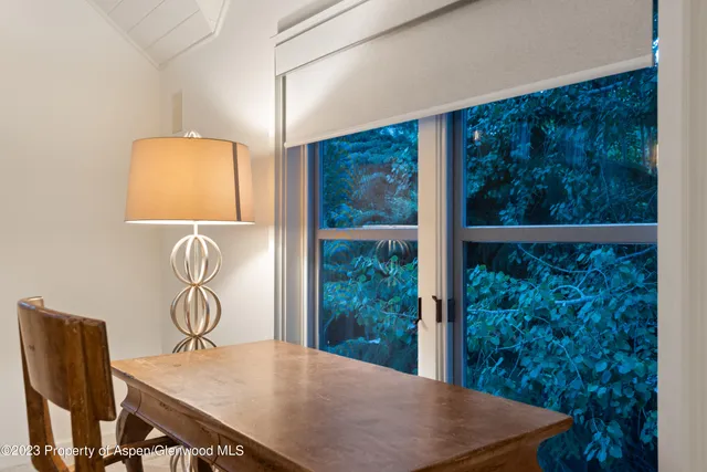 a room with a window and a projector