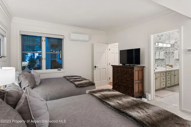 a living room with furniture and flat screen tv