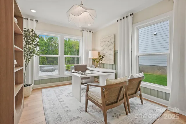 a workspace with furniture and a window