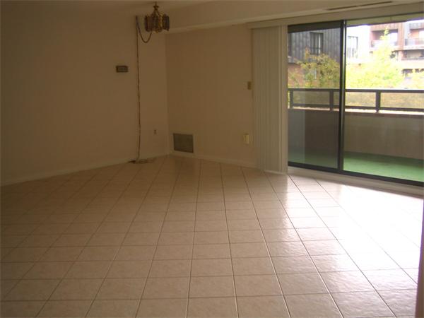 402 Paradise Road, Unit 3B Swampscott, MA 01907 - Photo 8 of 23 a view of an empty room with a window