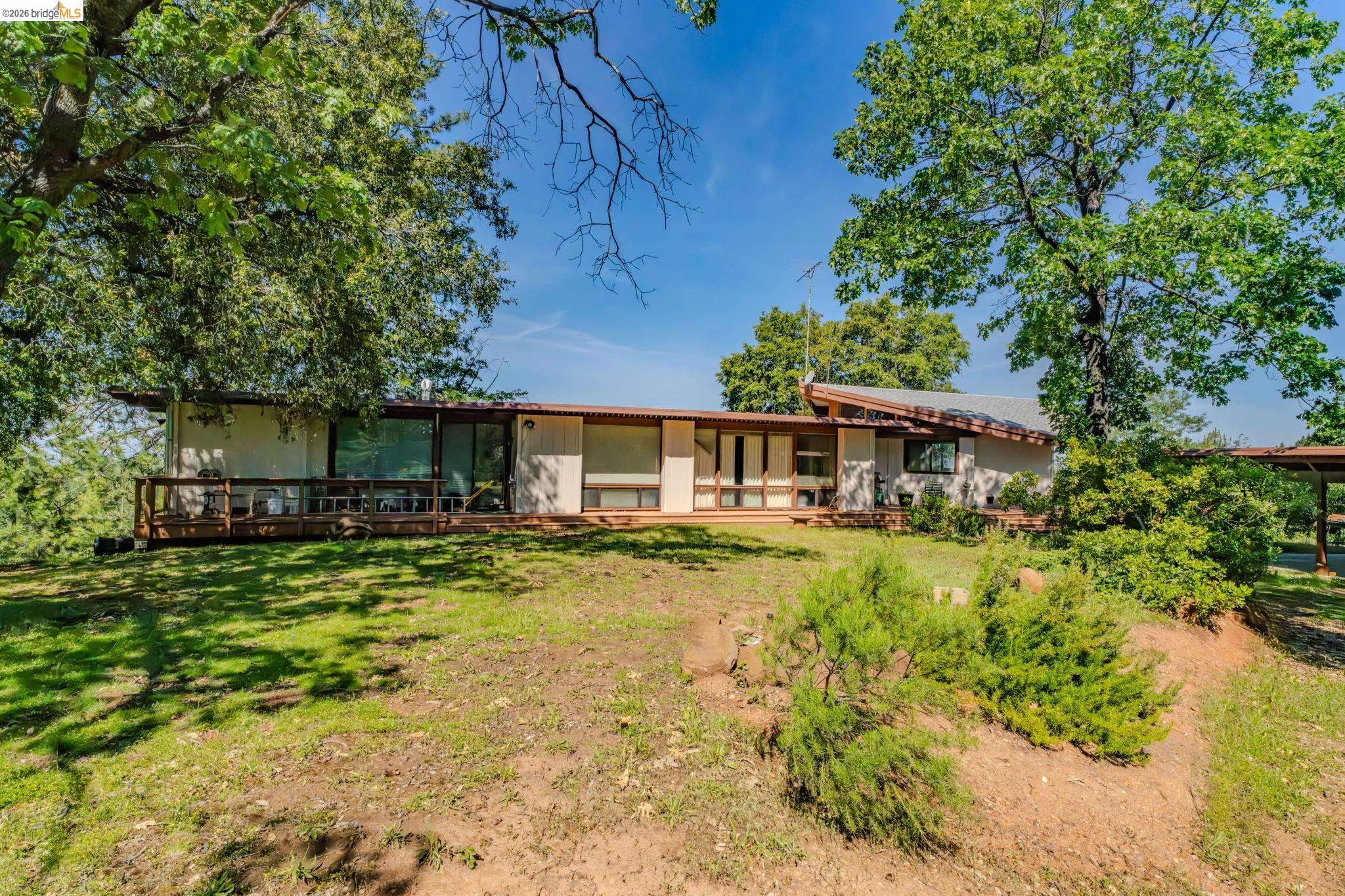 6161 Fullen Road Murphys, CA 95247 - Photo 51 of 53 a view of a house with a yard and sitting area