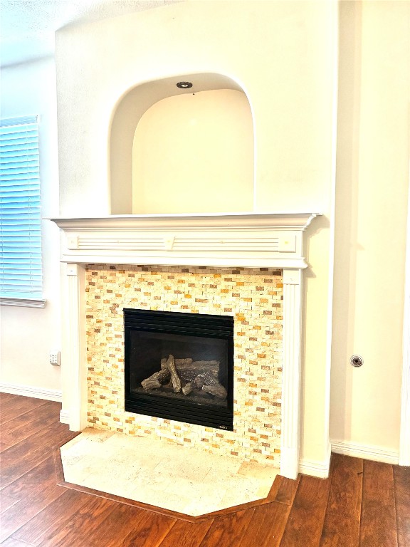 20518 Bonds Creek Lane Spring, TX 77388 - Photo 11 of 30 a living room with a fireplace and a wooden floor