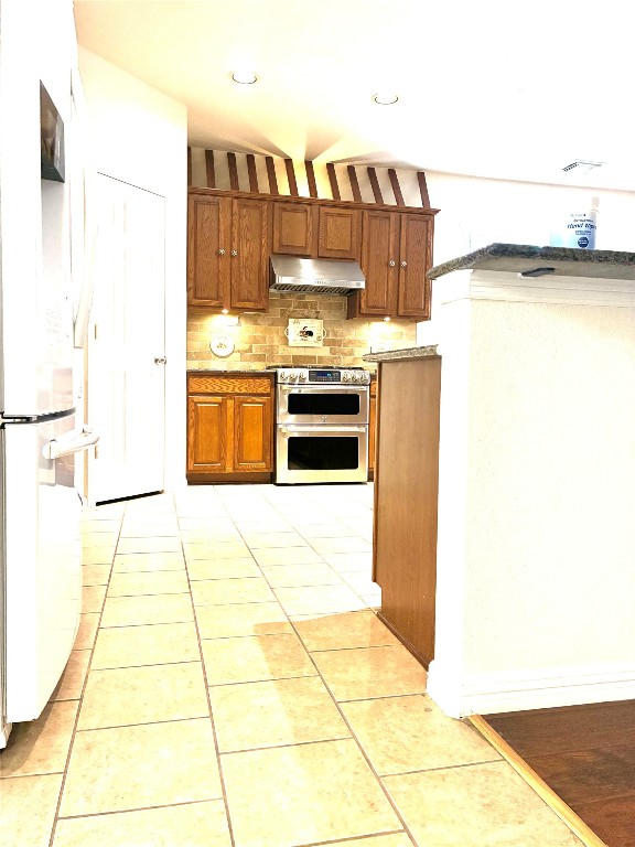 20518 Bonds Creek Lane Spring, TX 77388 - Photo 15 of 30 a kitchen with a sink and a stove