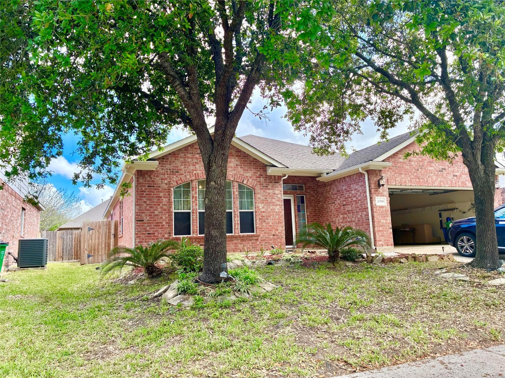20518 Bonds Creek Lane Spring, TX 77388 - Photo 2 of 30 a front view of a house with garden