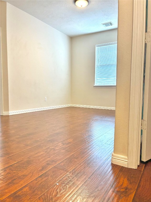 20518 Bonds Creek Lane Spring, TX 77388 - Photo 30 of 30 a view of an empty room with wooden floor and a window