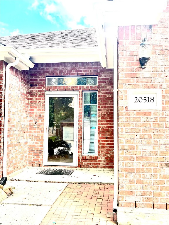 20518 Bonds Creek Lane Spring, TX 77388 - Photo 4 of 30 a view of a building with a door and a window