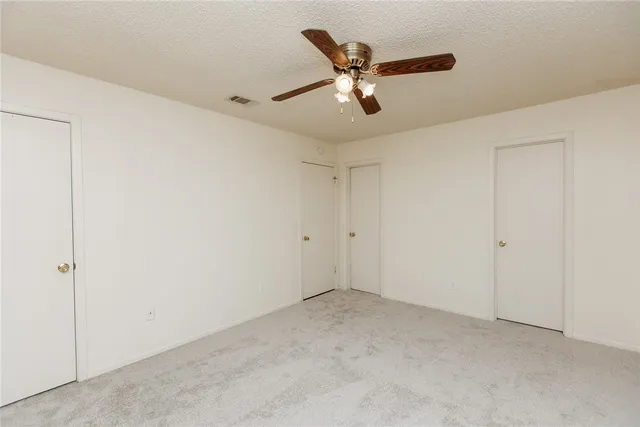 a view of a big room with carpet