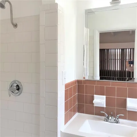 a kitchen with a sink stove and microwave