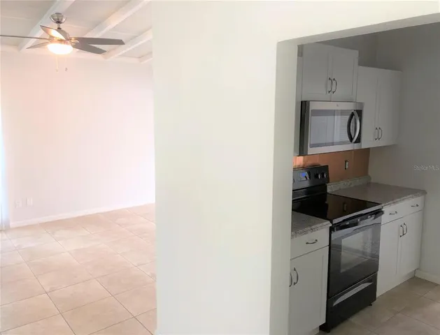 a view of a hallway with a window