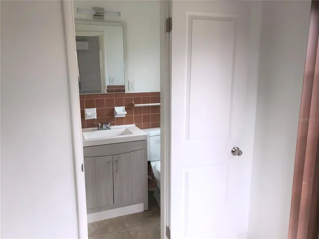 a hallway with a washer and dryer