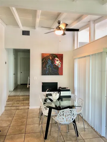 a view of a livingroom with furniture and a flat screen tv