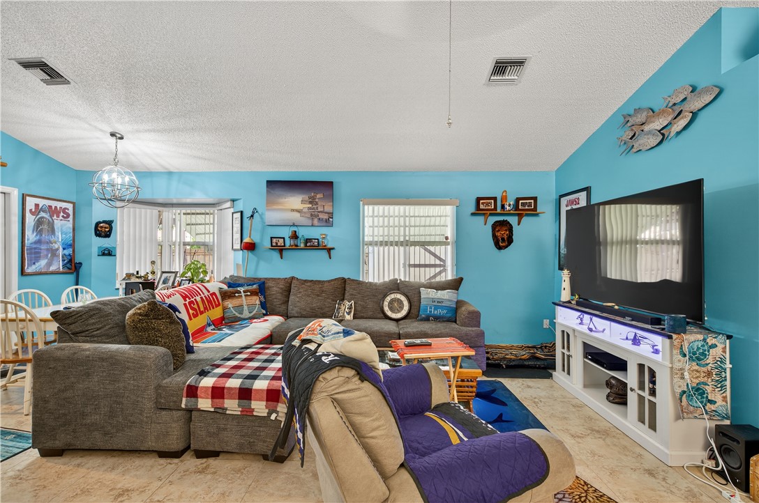1361 Clearbrook Street Sebastian, FL 32958 - Photo 14 of 29 a living room with furniture and a flat screen tv