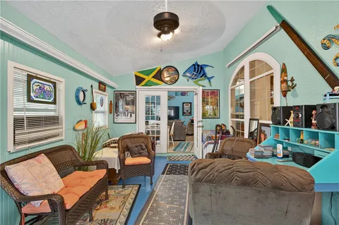 a living room with furniture and lamp