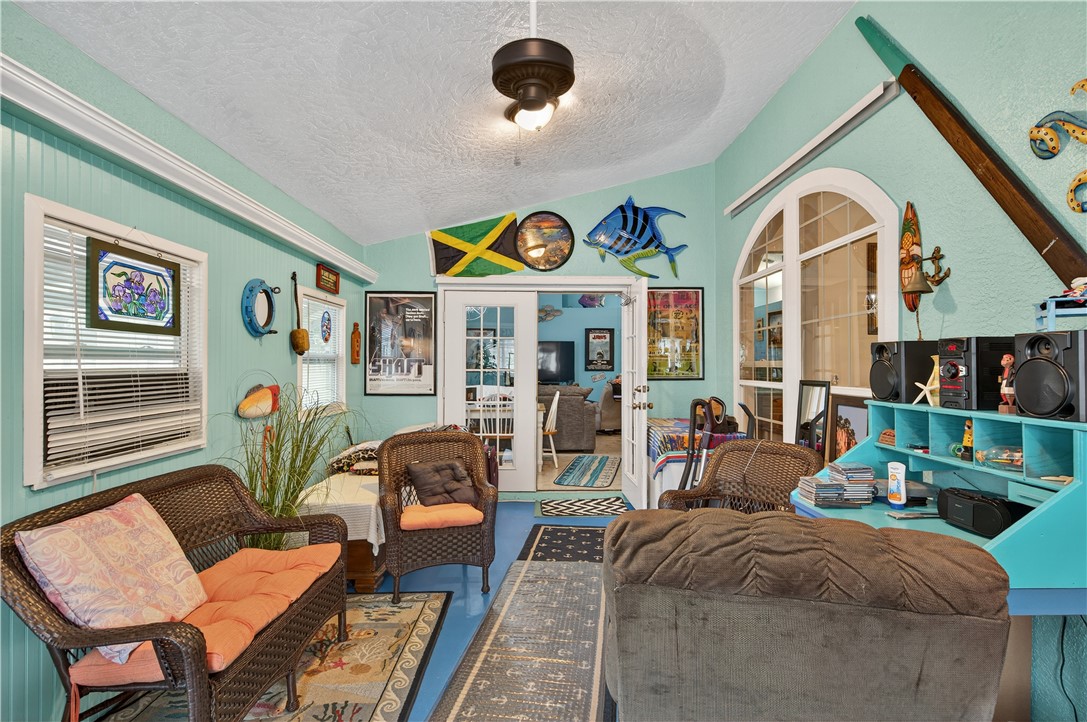 1361 Clearbrook Street Sebastian, FL 32958 - Photo 16 of 29 a living room with furniture and lamp