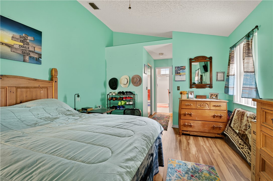 1361 Clearbrook Street Sebastian, FL 32958 - Photo 18 of 29 a bedroom with a bed and a dresser