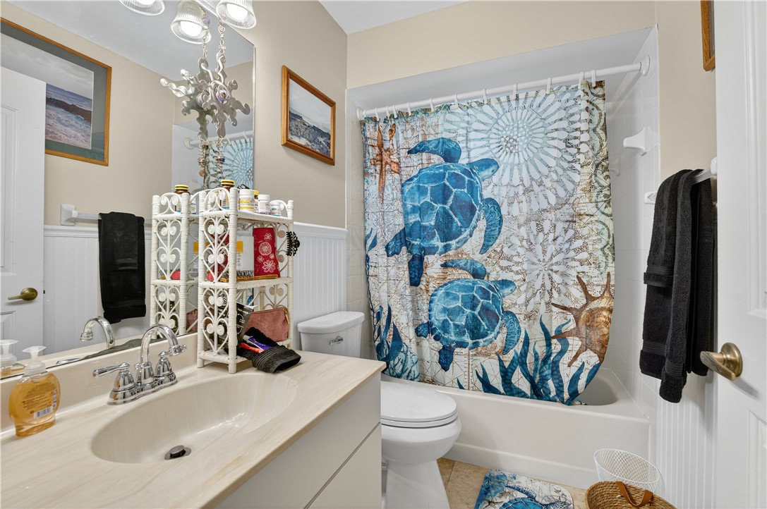 1361 Clearbrook Street Sebastian, FL 32958 - Photo 22 of 29 a bathroom with a sink mirror vanity and toilet