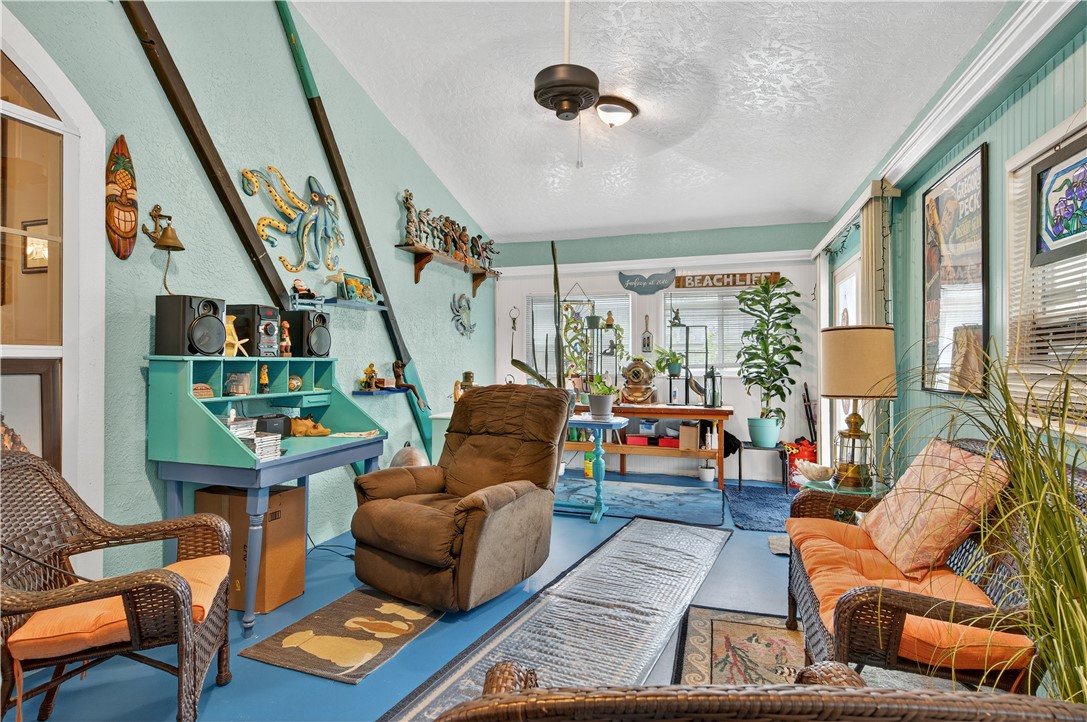 1361 Clearbrook Street Sebastian, FL 32958 - Photo 3 of 29 a living room with furniture rug and a large window
