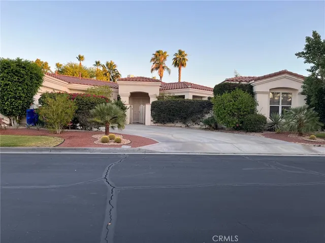 a view of house with outdoor space and swimming pool