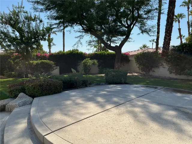 a view of a swimming pool with a yard