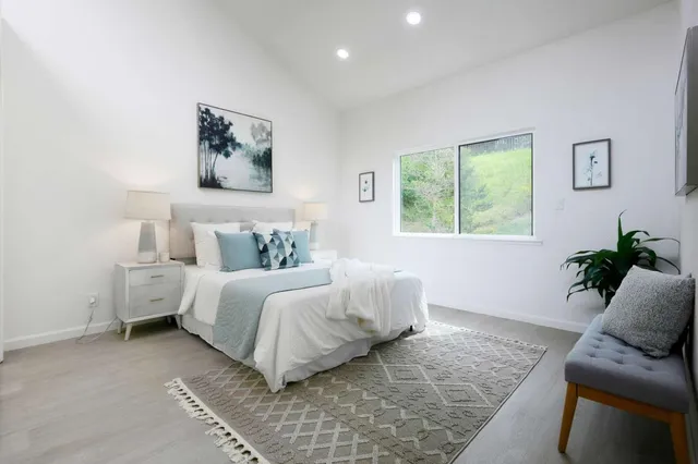 a bedroom with a bed and a couch