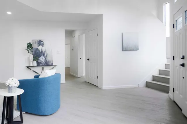 a view of a living room and bathroom