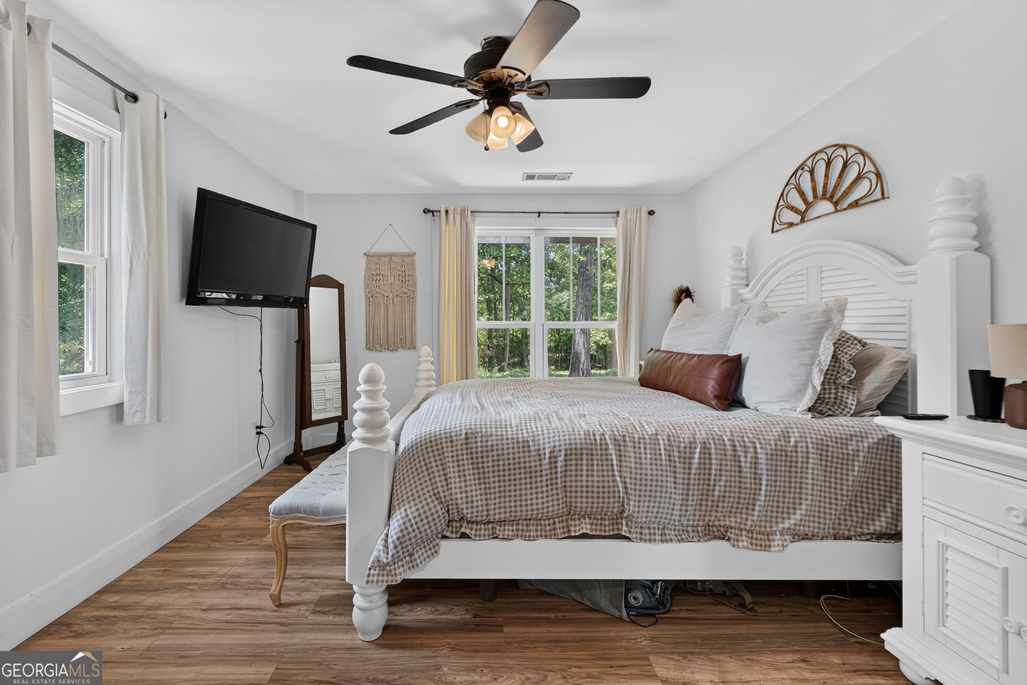 242 Harris Road Concord, GA 30206 - Photo 39 of 55 a bedroom with a bed and a flat screen tv