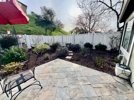 a view of a house with a yard and garage