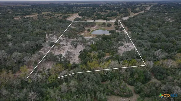 a aerial view of a house with a yard